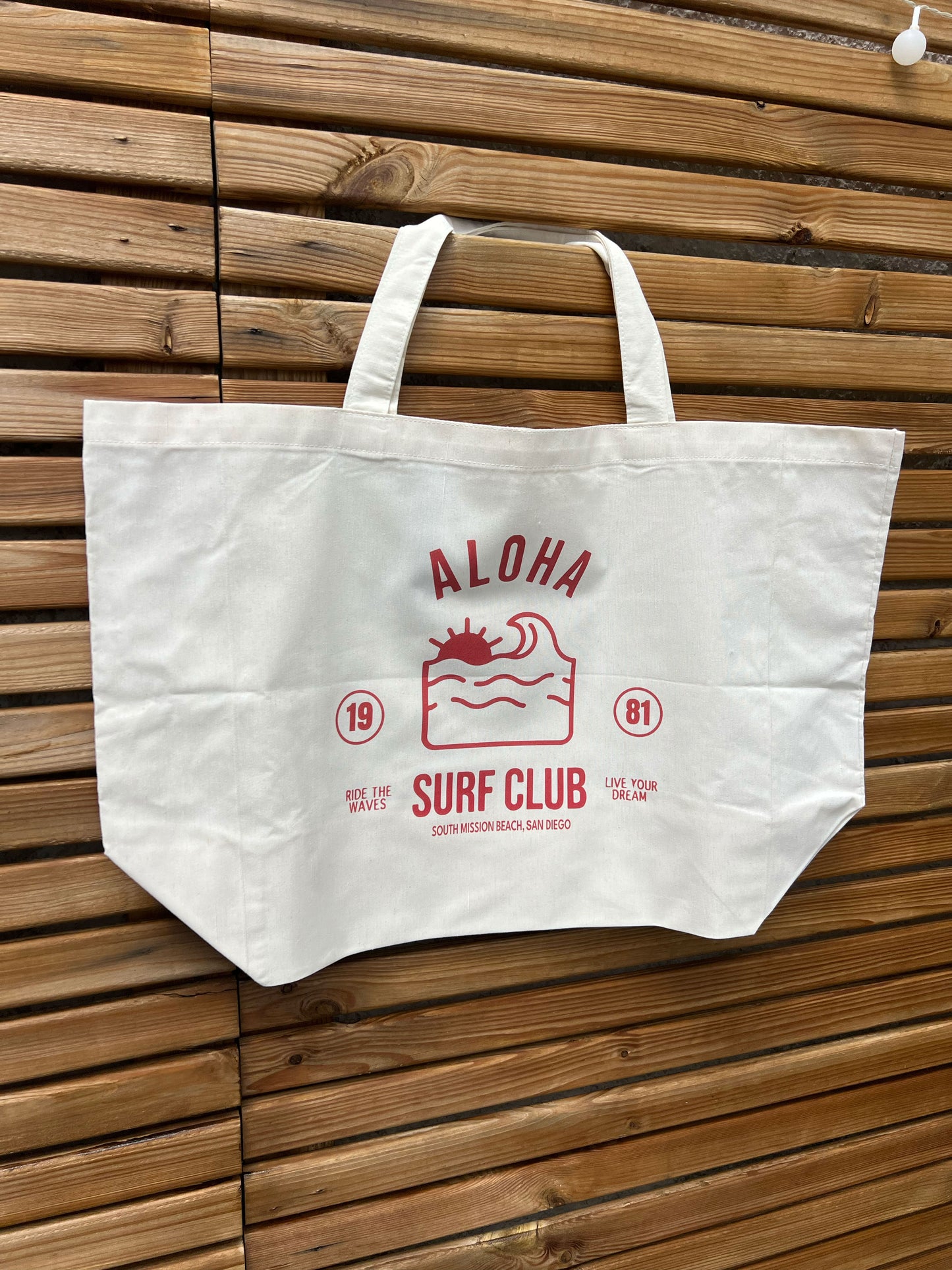 sac beige clair avec logo aloha rouge