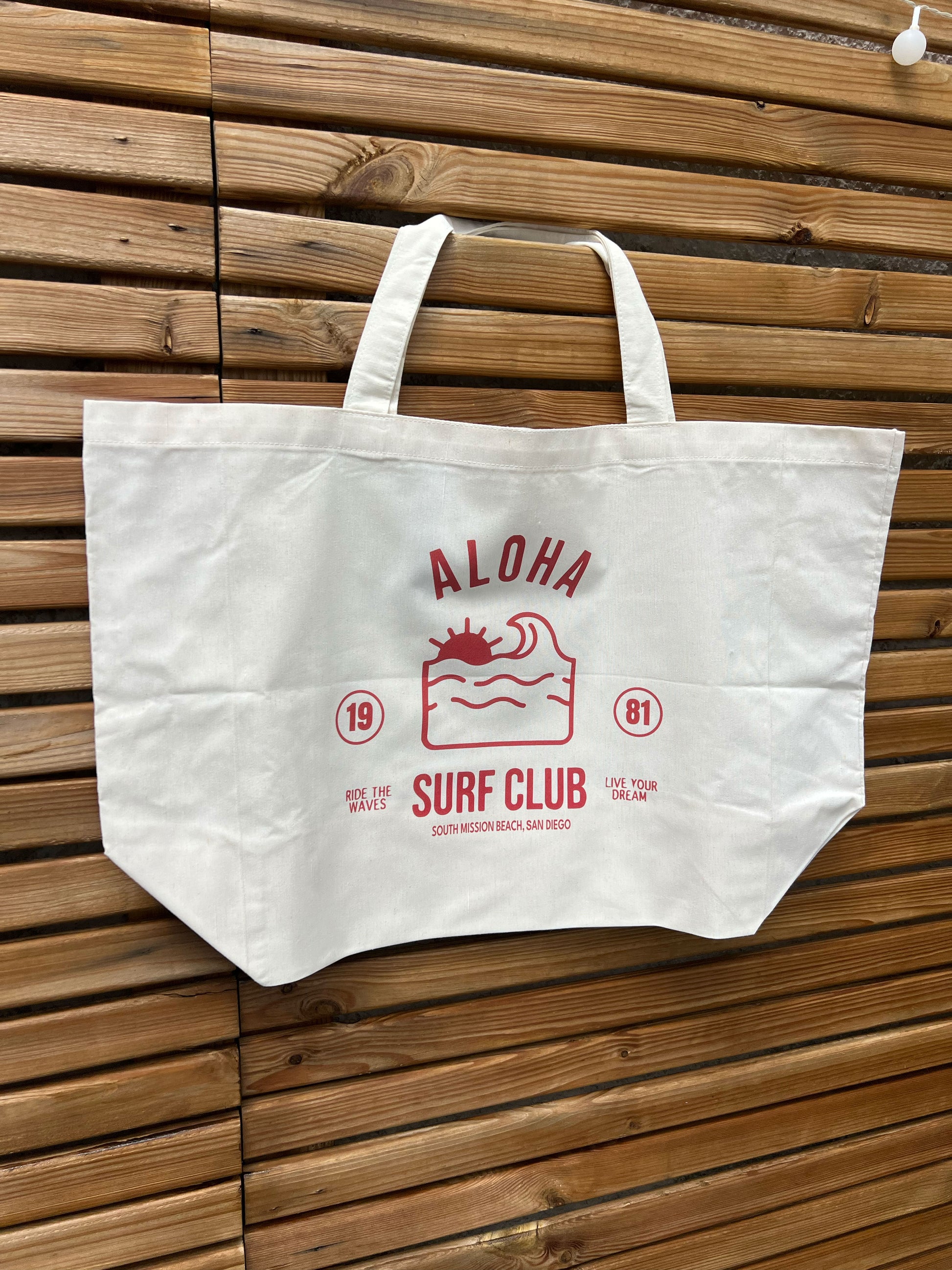 sac beige clair avec logo aloha rouge 
