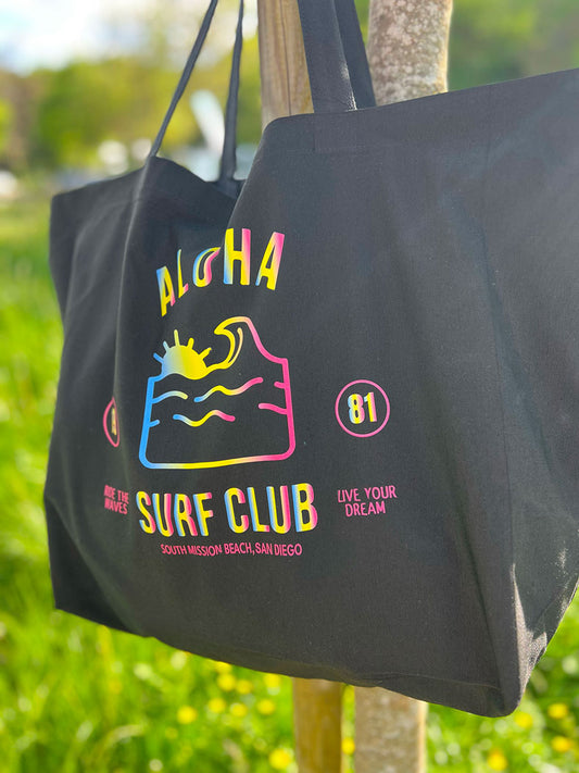 tote bag coton recyclé noir léger avec un logo rainbow coloré idéal en after session surf
